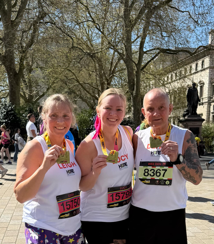 London Landmarks Half Marathon East Kent team 3 London Landmarks Half Marathon runners showing their medals after the race.