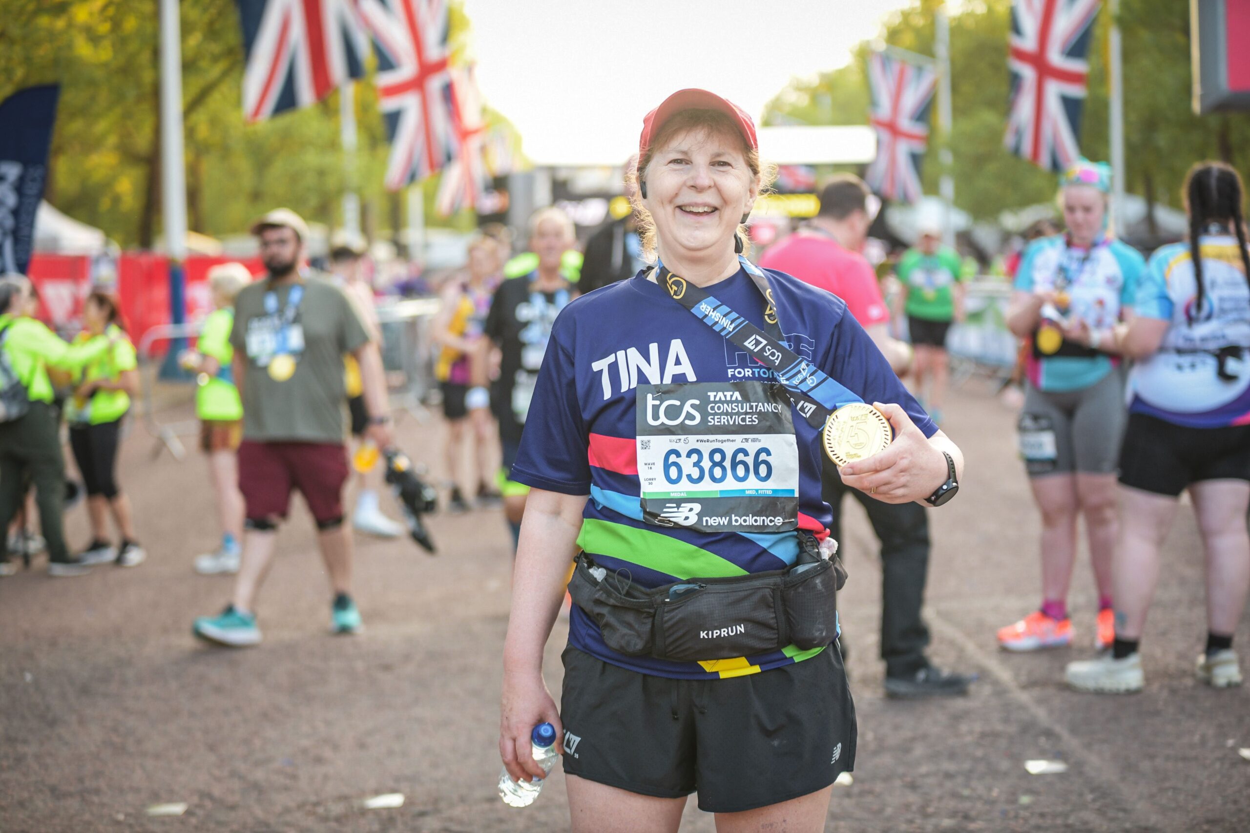 Tina Dyer-Slade after London Marathon 6 Tina holding her medal after completing the London Marathon