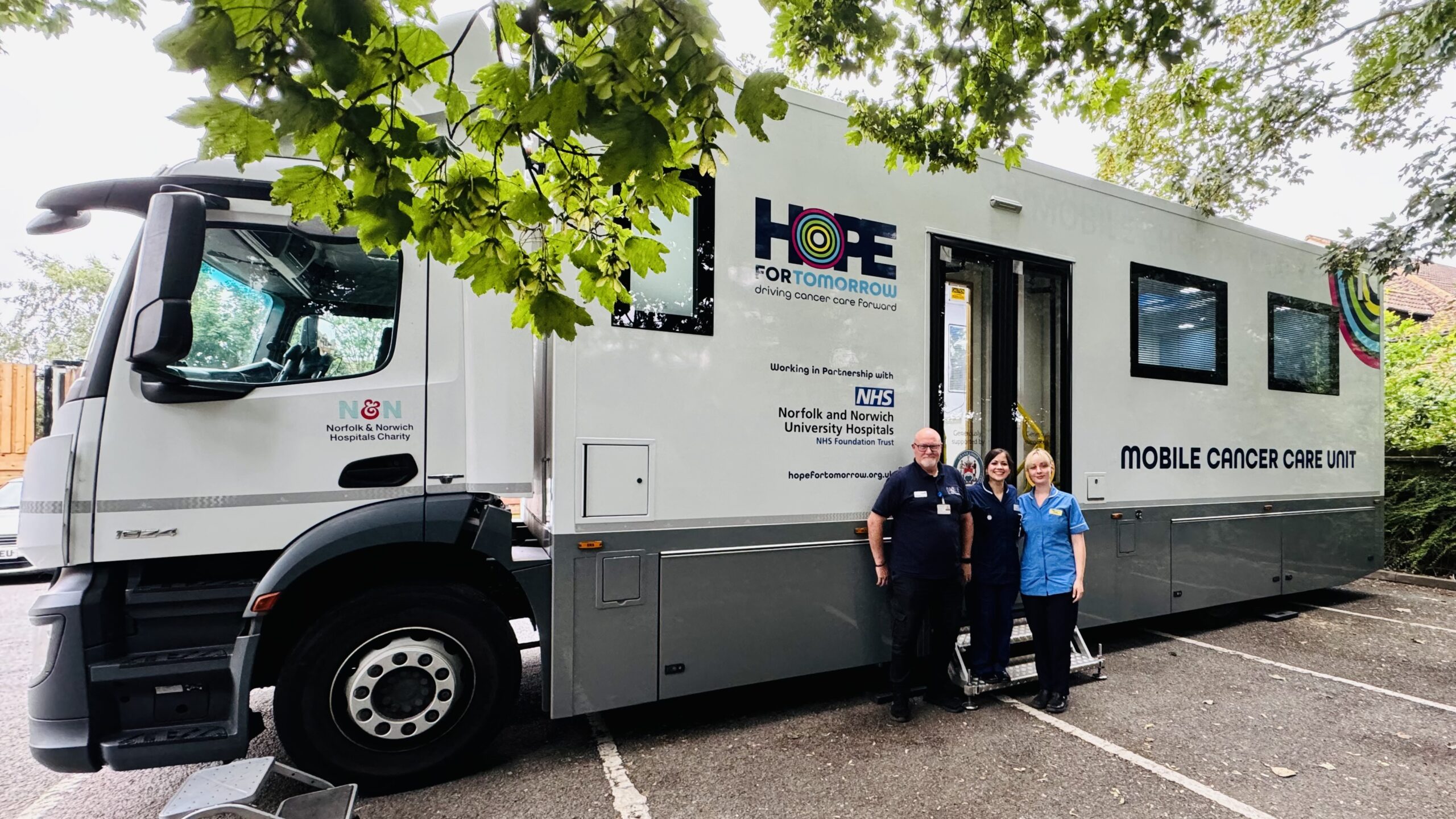 An image showing the front and side of Hope for Tomorrow's West-Suffolk-based mobile cancer care unit, Frisbey..
