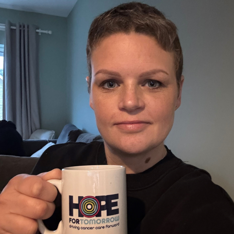 Joanne York holding a Hope for Tomorrow mug