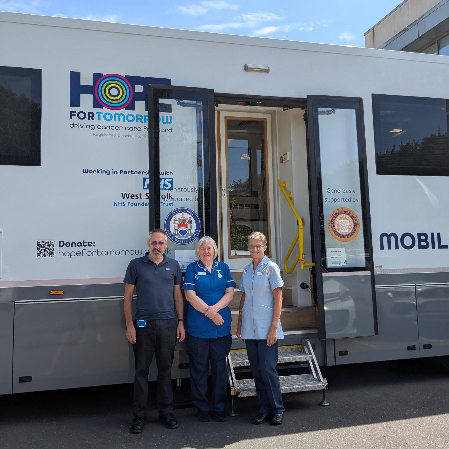 An image showing the front and side of Hope for Tomorrow's West-Suffolk-based mobile cancer care unit, Frisbey.