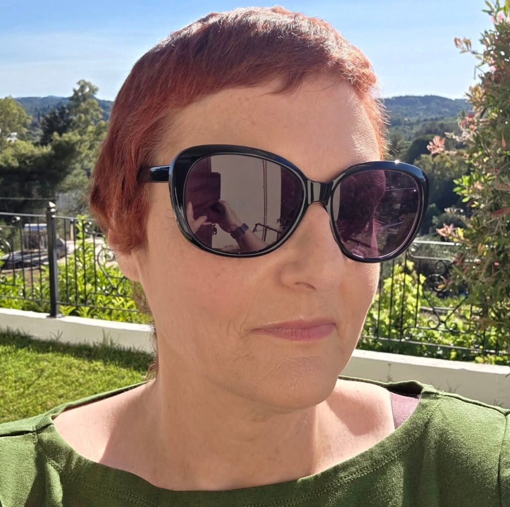 A selfie of Joanne Everley with her sunglasses on enjoying the sunshine