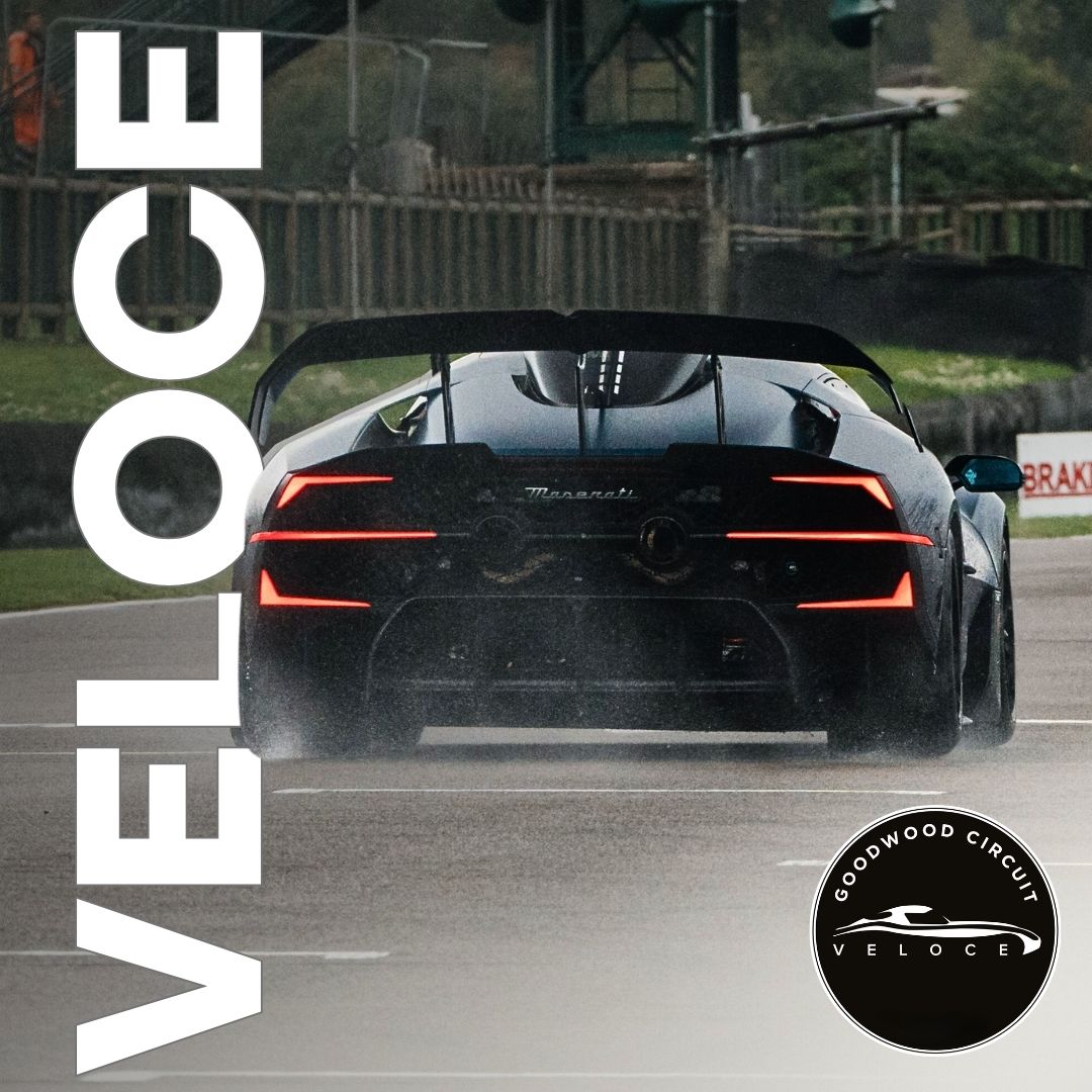 A crowd of people and cars at Goodwood motor circuit for the Veloce event